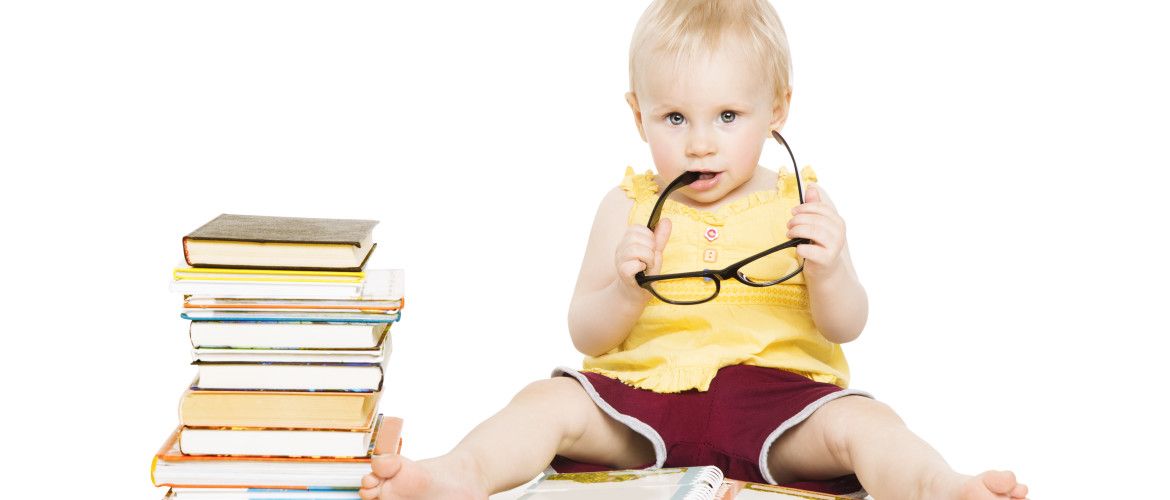 Little Child Girl Reading Book in Glasses, Children Early Development, Small Kid Preschool Education Concept, Isolated over White Background