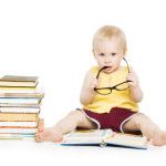 Little Child Girl Reading Book in Glasses, Children Early Development, Small Kid Preschool Education Concept, Isolated over White Background